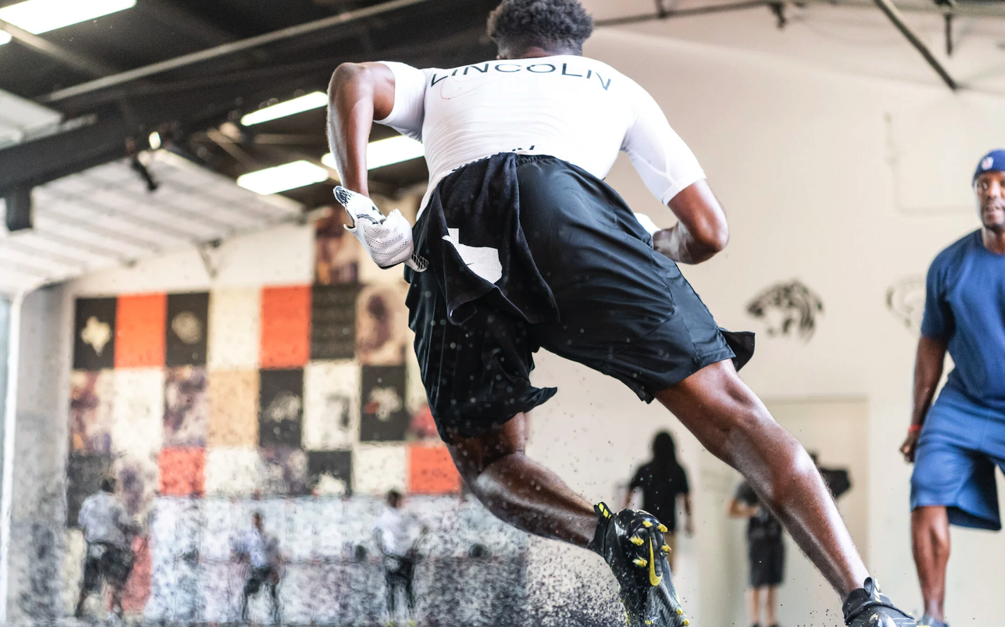 Dallas Football Warehouse athlete sprinting with Nike gear