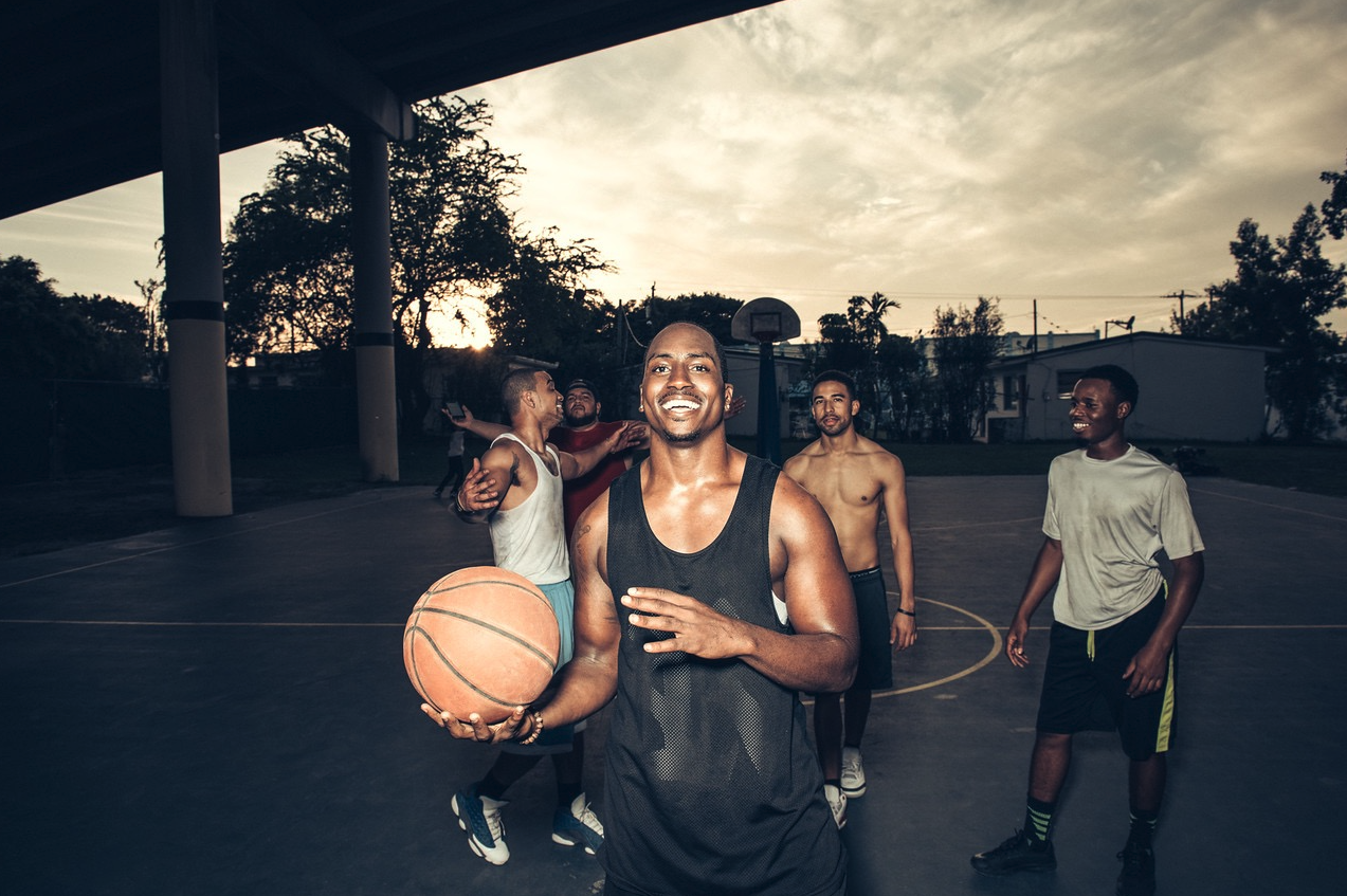 Marcus Majors on a basketball court at sunset for the Facebook campaign