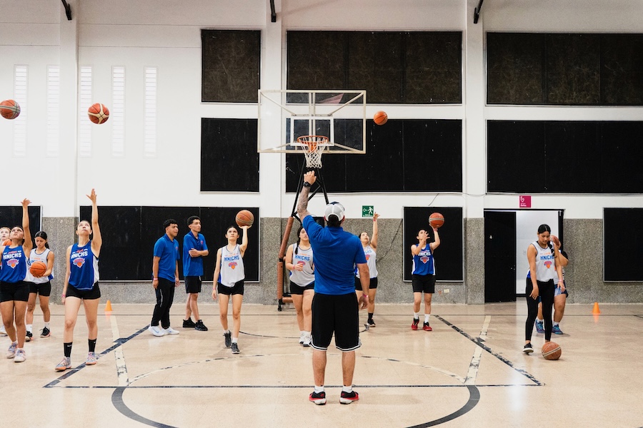Athlete training during a youth basketball shooting drill